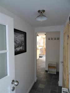 a hallway in a home with a ceiling fan at Stachelburg in Monschau