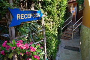 a blue sign that says regency is attached to a building at Apartamentos Turisticos Trajano in Bolonia