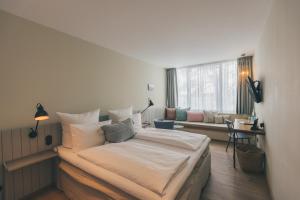 Postel nebo postele na pokoji v ubytování Hotel Strandleben