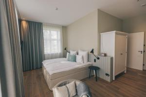 Postel nebo postele na pokoji v ubytování Hotel Strandleben