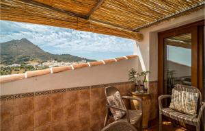 a balcony with chairs and a view of a mountain at Stunning Home In Gaucin With Wifi in Gaucín