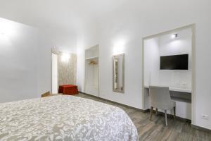 Posteľ alebo postele v izbe v ubytovaní Vittorio Emanuele Charming Central Flats
