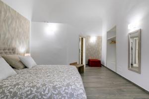 Posteľ alebo postele v izbe v ubytovaní Vittorio Emanuele Charming Central Flats
