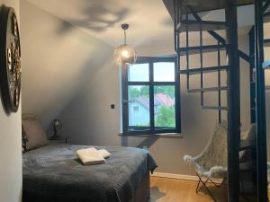 Postel nebo postele na pokoji v ubytování MazuryDreamHouse