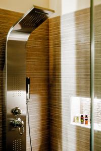 a shower in a bathroom with a glass door at Dim House in Parga