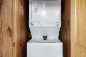 a white washing machine with a cup on top of it at Beary Patch Hill Hot Tub 9 Miles to Great Smoky Mtn National Park in Sevierville
