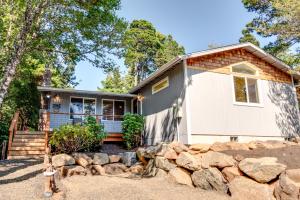 a home with a stone retaining wall at Gray Whale Cove MCA 935 in Manzanita