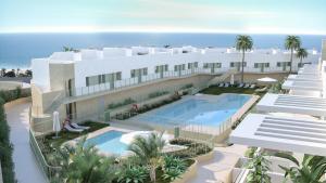 Вид на бассейн в Lovely New Luxery Beach Apartment in Mojacar Playa или окрестностях