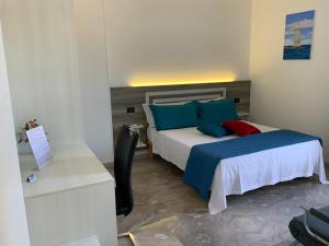 Postel nebo postele na pokoji v ubytování Oasi nel Deserto
