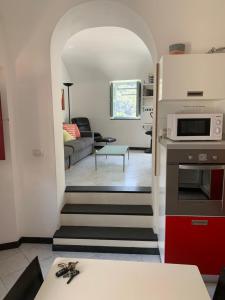 a stairway leading to a kitchen and a living room at Spacious 2 bedroom condo in Colletta