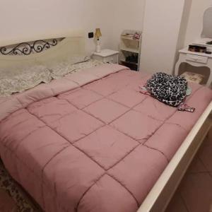 A bed or beds in a room at L' incantevole Tana di Oto
