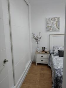 A bed or beds in a room at APARTAMENTO EL LLANO