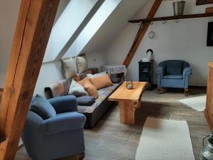 a living room with a couch and a table at Ferienwohnung Holzer in Payerbach