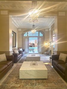 a living room with a couch and a coffee table at Magnolia Inn in Panama City