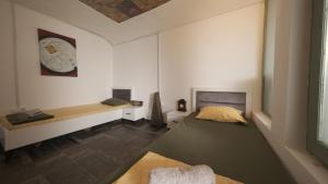 Postelja oz. postelje v sobi nastanitve Hostel Dera
