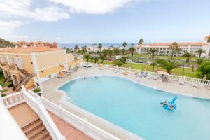 a view of a swimming pool at a resort at Apartamento Sara en el Veril del Duque - Sara Vacation in Adeje