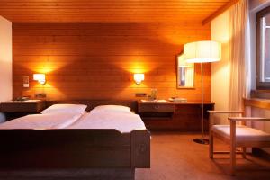 Cama o camas de una habitación en Krone Hittisau - Hotel & Restaurant im Bregenzerwald