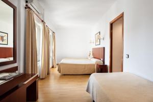 Cama o camas de una habitación en Crisol Riosol