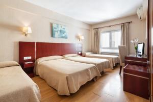 Cama o camas de una habitación en Crisol Riosol