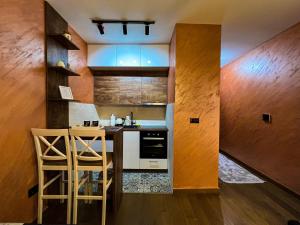 a kitchen with a counter and a stove top oven at Green Hills by MI in Podgorica