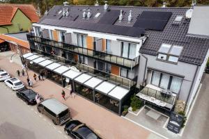 an overhead view of a building with a solar roof at Rezydencja Morski Tygiel in Łeba