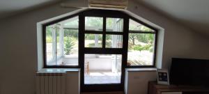 a large window in a room with an attic at Apartma Ivan in Portorož