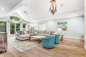 a living room with a couch and a table at 13 Green Winged Teal in Fernandina Beach