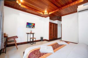 Postel nebo postele na pokoji v ubytování P5 Angkor Residence