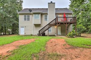 a house with a deck on the front of it at Covington Abode Less Than 30 Mi to Stone Mtn Park! in Covington