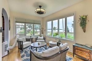 a living room with a couch and a table at Walkable New Haven Retreat with Ocean Views! in New Haven
