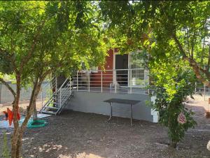 a building with a picnic table in front of it at Cıralı müstakil apart in Kemer