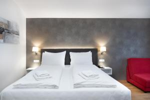 Postel nebo postele na pokoji v ubytování Hotel Dvorec