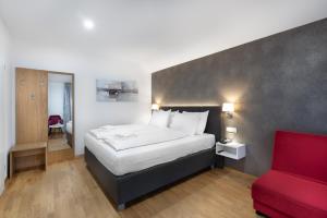 Postel nebo postele na pokoji v ubytování Hotel Dvorec