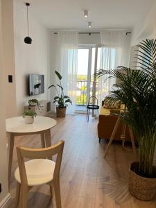 TV a/nebo společenská místnost v ubytování Apartament 4 piętro + 2 fotografie