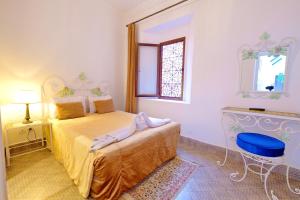 Postel nebo postele na pokoji v ubytování Riad Hôtel Essaouira