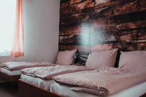 Uma cama ou camas num quarto em Hotel Alf