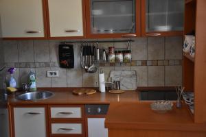 a kitchen with a sink and a counter top at Apartment Music-center, in the center of Podgorica in Podgorica