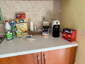 a kitchen counter with food items on top of it at La Casa di Gabry 2 in Valledolmo