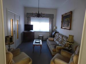 a living room with a couch and a table at Vakantiewoning Louis in Mechelen