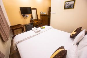 Postel nebo postele na pokoji v ubytování Hotel Cecil