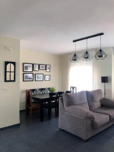 a living room with a couch and a table at La Duquesa del Valle in Cabezuela del Valle