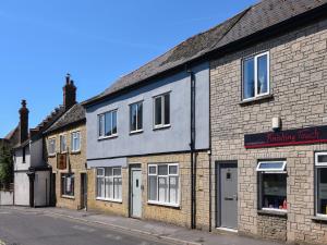 a row of brick buildings on a street at Ayla in Lyme Regis