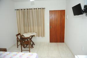 TV a/nebo společenská místnost v ubytování Pousada Gruta do Anjo