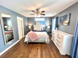 a bedroom with a bed and a ceiling fan at The Absolute Best Home Away From Home Pet Friendly!!! in Wilmington
