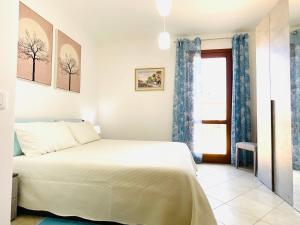 Posteľ alebo postele v izbe v ubytovaní Villa Kate Pula Sardegna