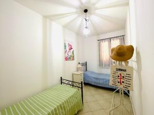 Posteľ alebo postele v izbe v ubytovaní Villa Kate Pula Sardegna