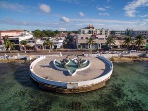 a fountain in the middle of a body of water at Cozumel 568 - Vacation Rental in Cozumel +3 photos