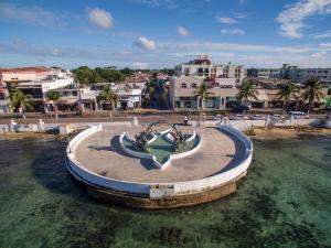 a fountain in the middle of a body of water at Cozumel 400A - Vacation Rental in Cozumel