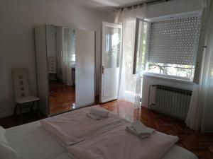 Postel nebo postele na pokoji v ubytování Apartment Selce 2381d