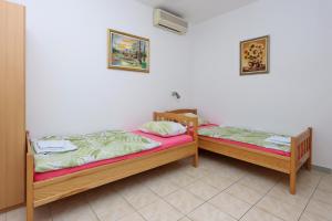 Postel nebo postele na pokoji v ubytování Twin Room Selce 2362a